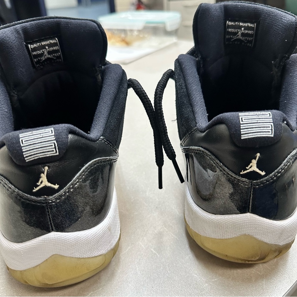 Jordan 11 Black and White Sneakers with Gold Accents - Picture 3 of 10
